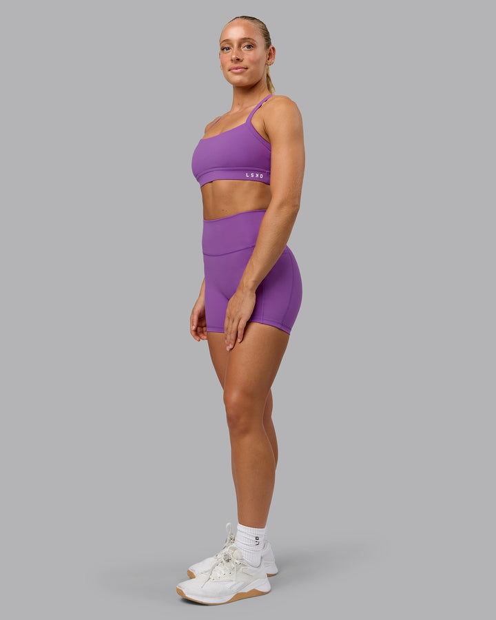 Woman wearing Momentum Sports Bra - Purple Fizz
