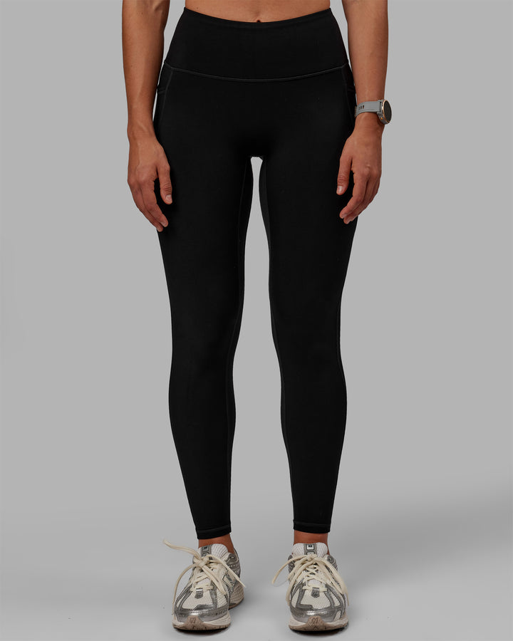 Woman wearing Motion Full Length Thermal Leggings - Black
