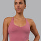 Woman wearing Movement Active Tank - Mauve Haze