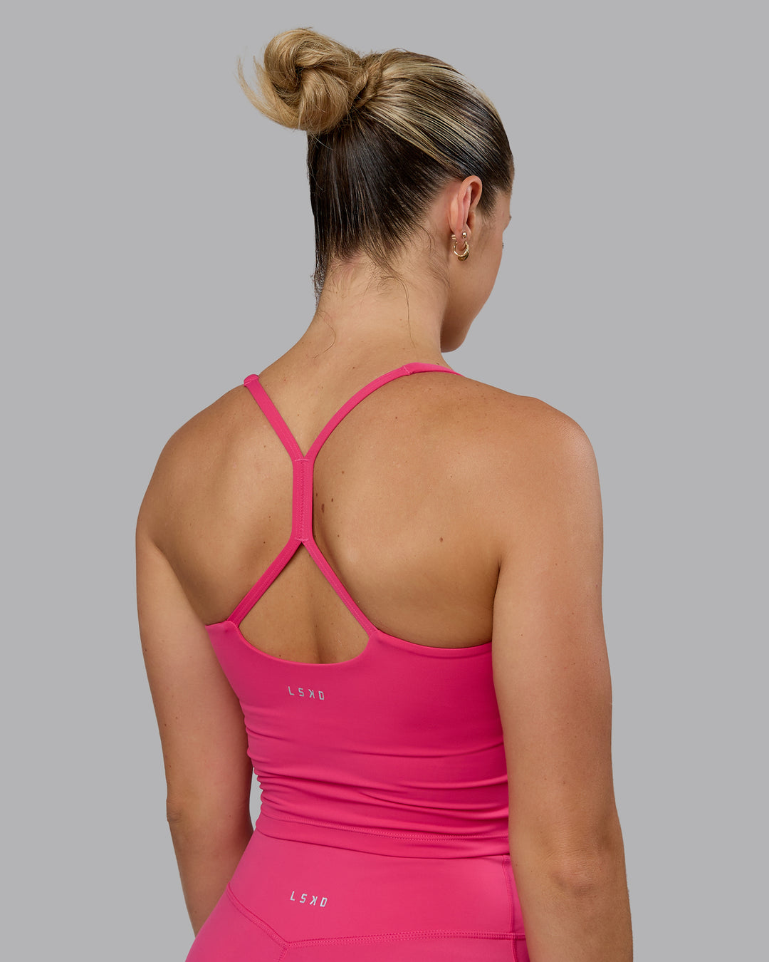 Woman wearing Movement Active Tank - Pink Flash