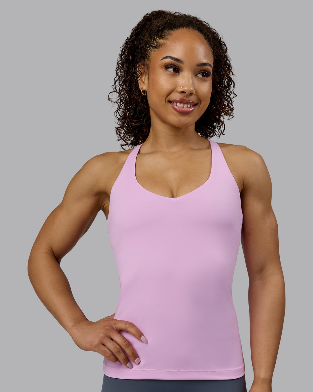 Woman wearing Movement Longline Active Shelf Bra Tank - Pastel Orchid