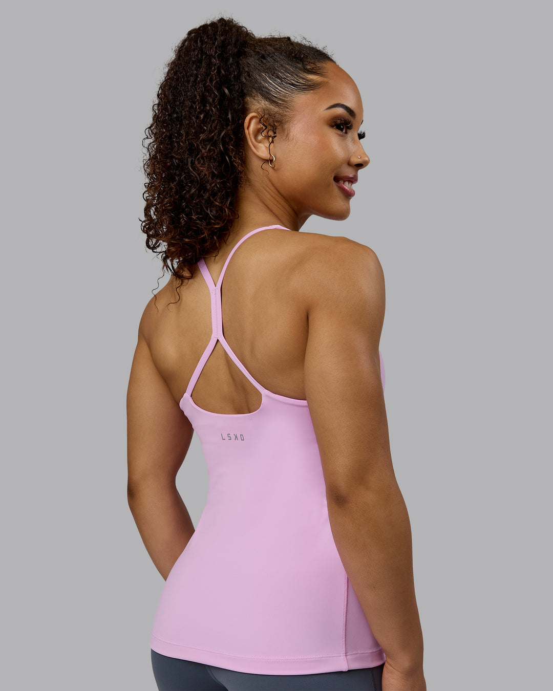 Woman wearing Movement Longline Active Shelf Bra Tank - Pastel Orchid