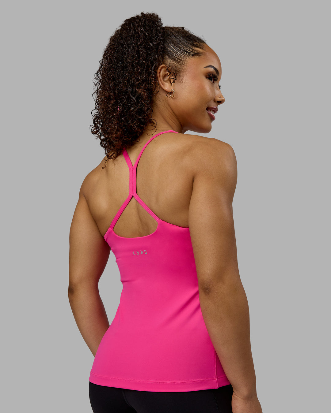 Woman wearing Movement Longline Active Shelf Bra Tank - Ultra Pink