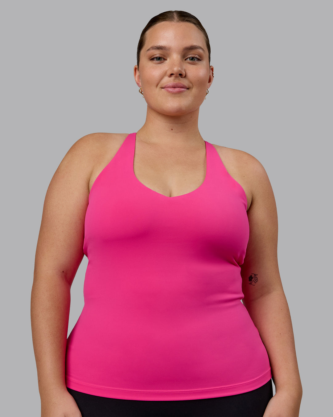 Woman wearing Movement Longline Active Shelf Bra Tank - Ultra Pink