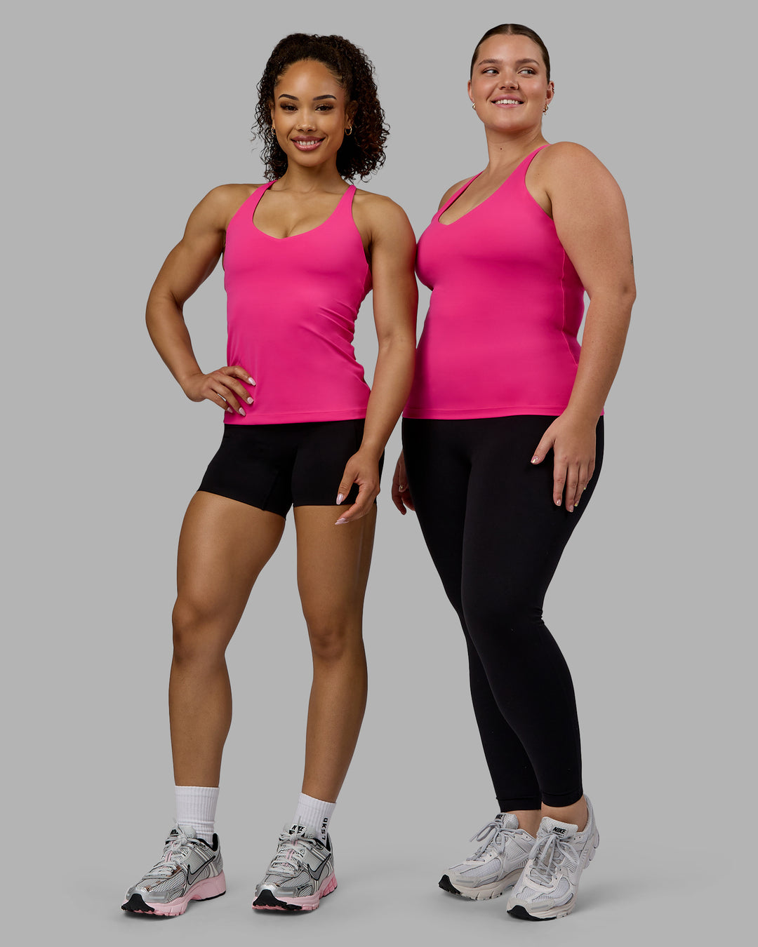 Woman wearing Movement Longline Active Shelf Bra Tank - Ultra Pink