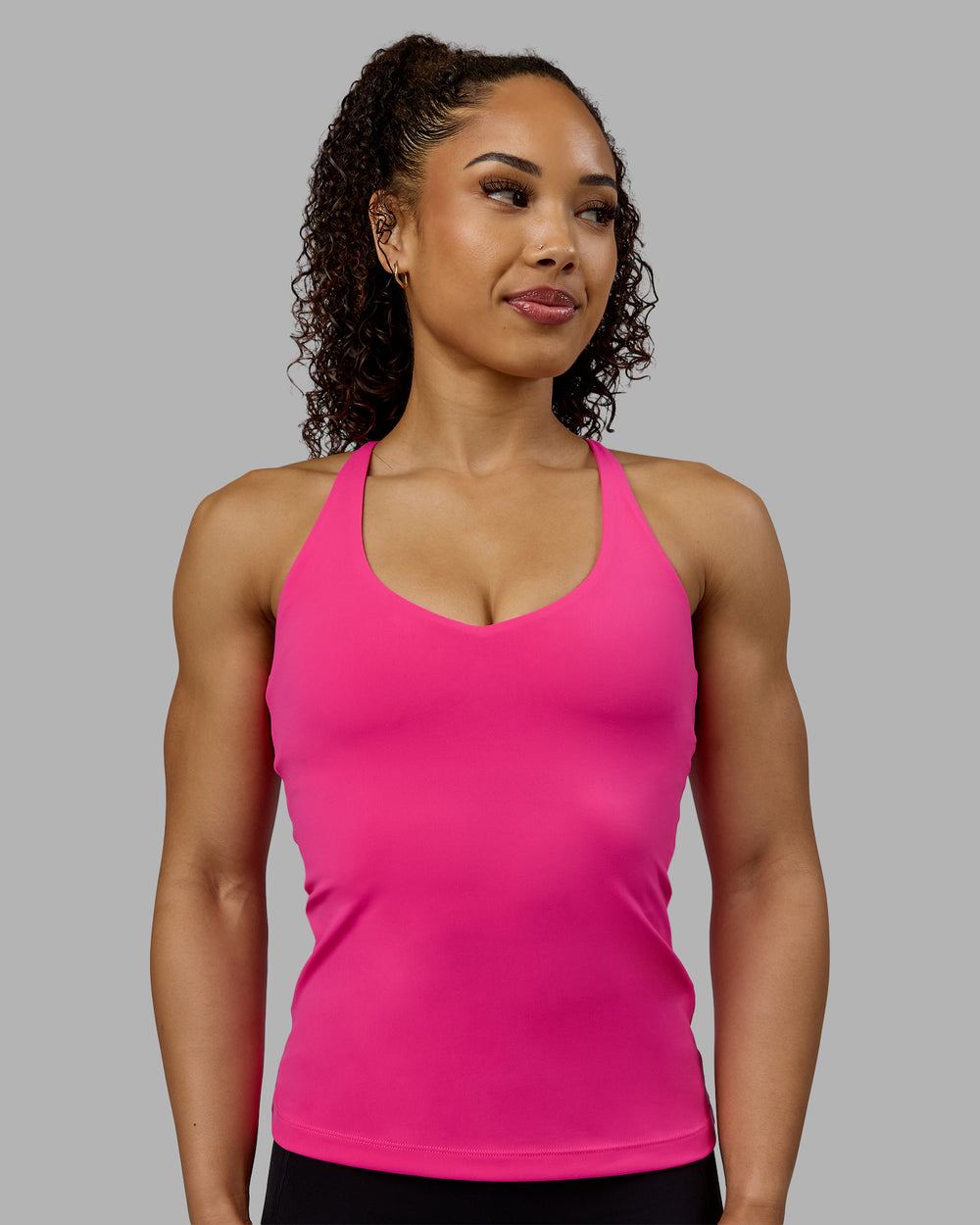 Woman wearing Movement Longline Active Shelf Bra Tank - Ultra Pink