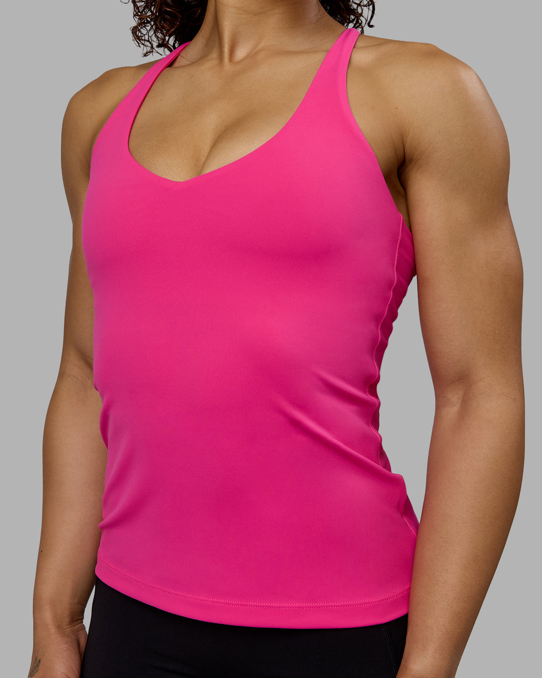 Woman wearing Movement Longline Active Shelf Bra Tank - Ultra Pink