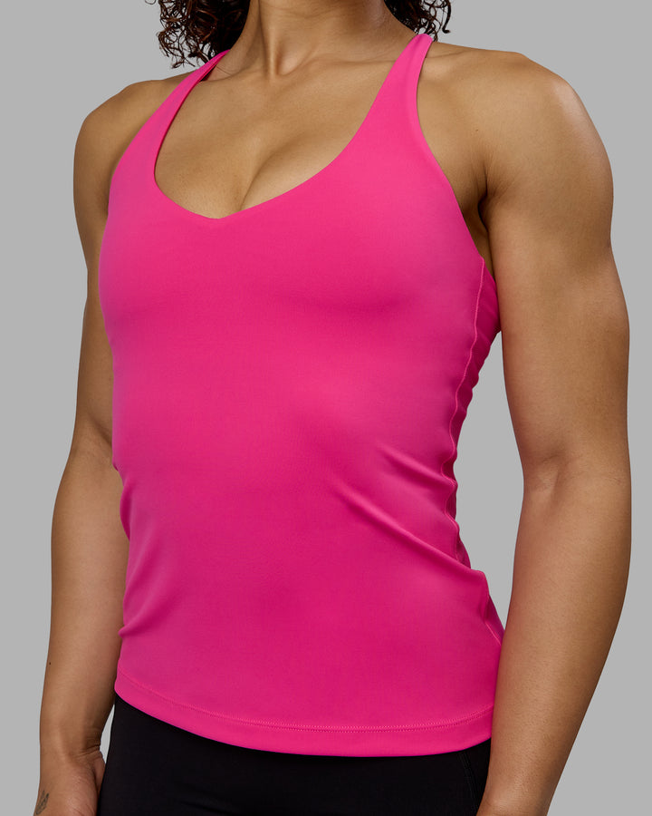 Woman wearing Movement Longline Active Shelf Bra Tank - Ultra Pink
