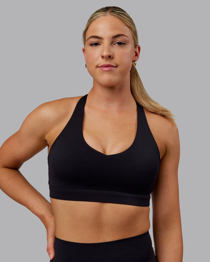 Woman wearing Nirvana Sports Bra - Black
