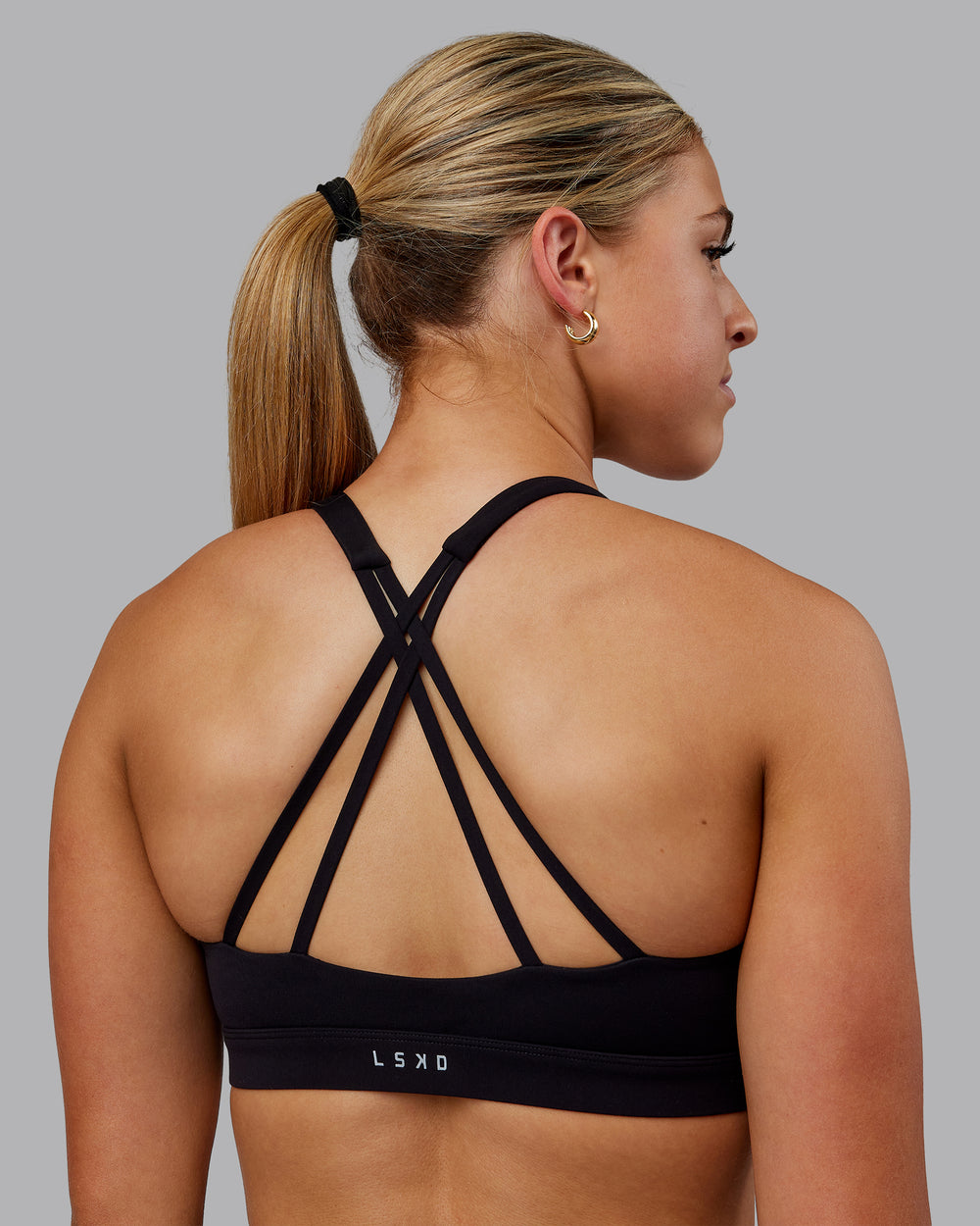 Woman wearing Nirvana Sports Bra - Black