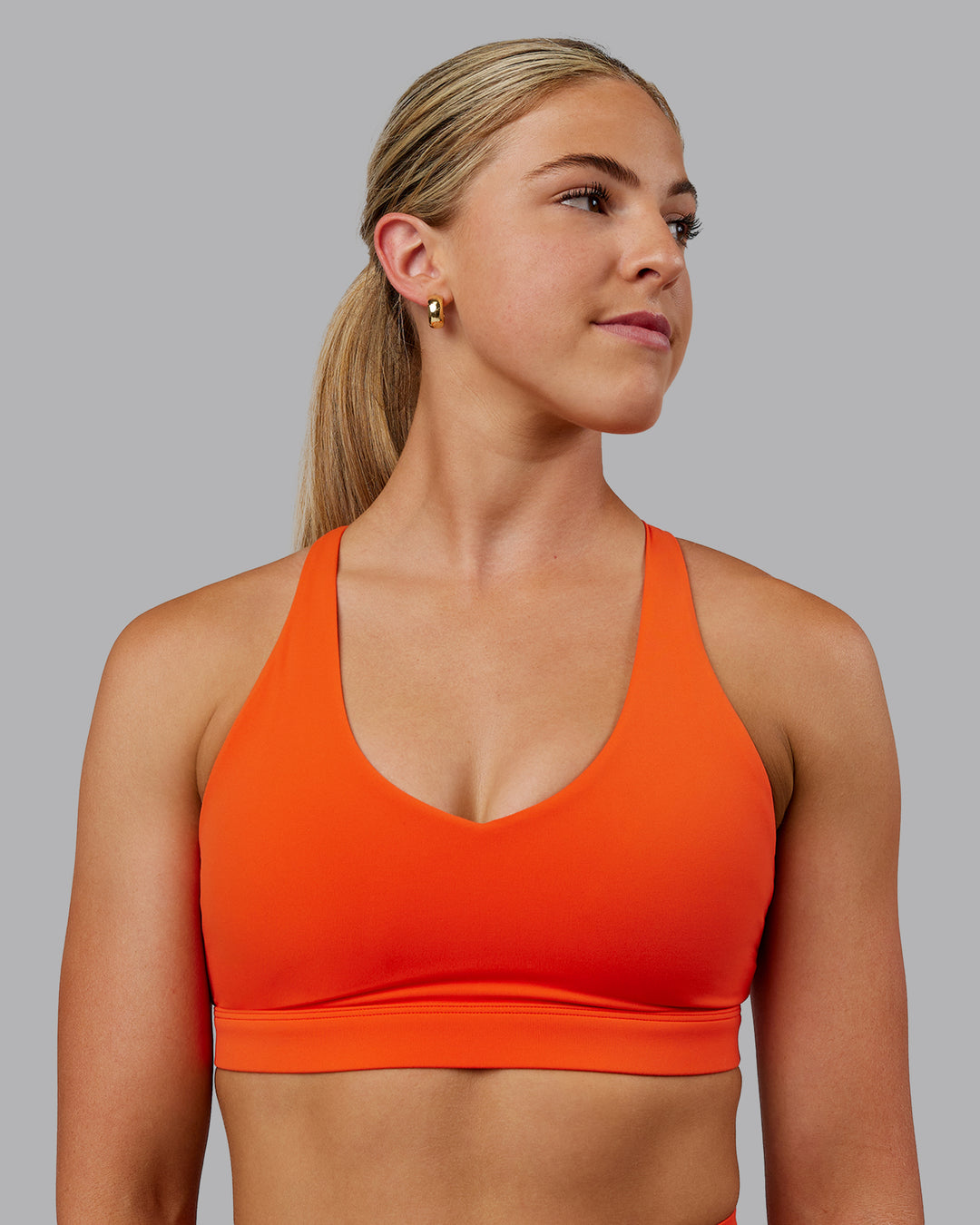 Woman wearing Nirvana Sports Bra - Grenadine