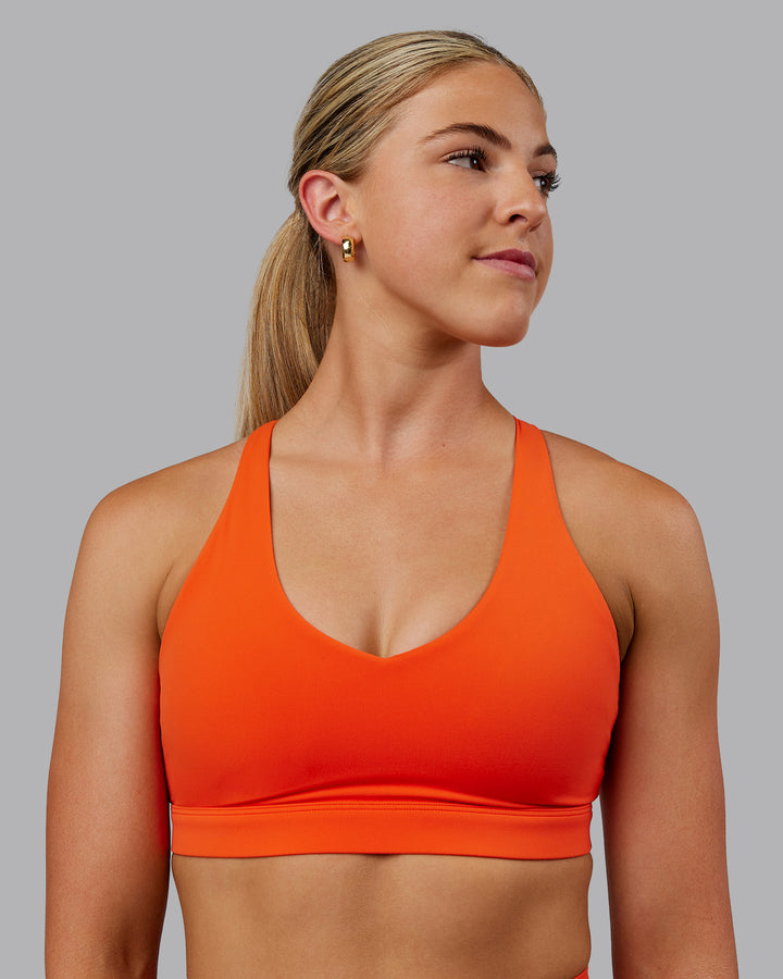 Woman wearing Nirvana Sports Bra - Grenadine
