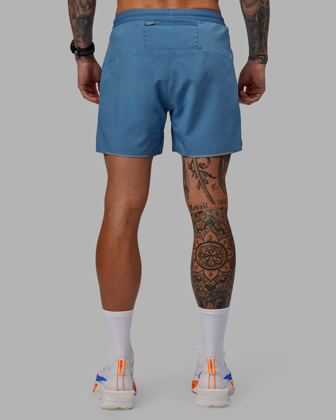 Man wearing Pace 5&quot; Lined Performance Shorts - Elemental Blue