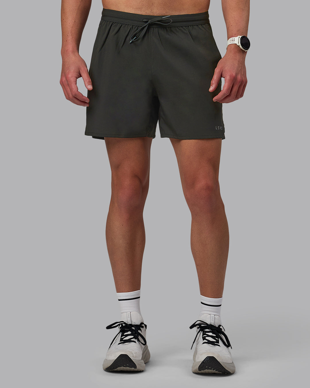 Man wearing Pace 5&quot; Lined Performance Shorts - Pirate Black