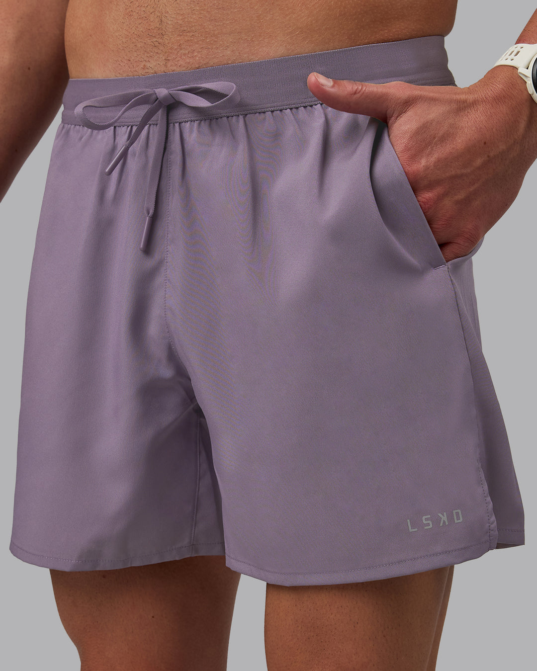 Man wearing Pace 5&quot; Lined Performance Shorts - Purple Sage