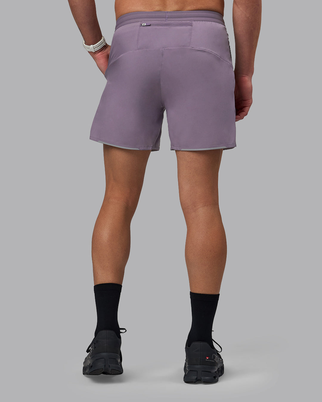 Man wearing Pace 5&quot; Lined Performance Shorts - Purple Sage