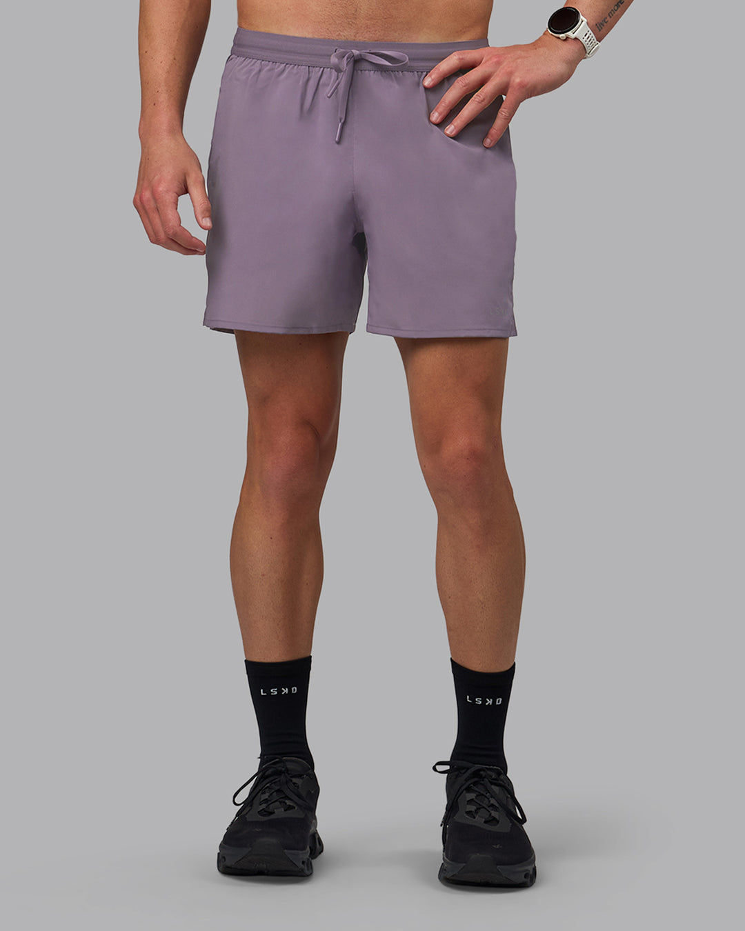 Man wearing Pace 5&quot; Lined Performance Shorts - Purple Sage