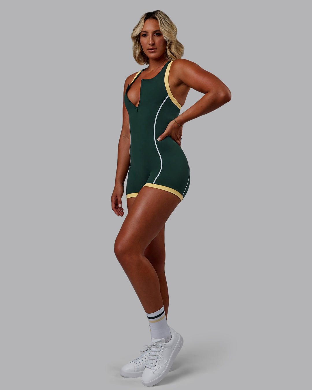 Woman wearing Patty Mills Pace Sprinting Suit - Vital Green-Pale Banana