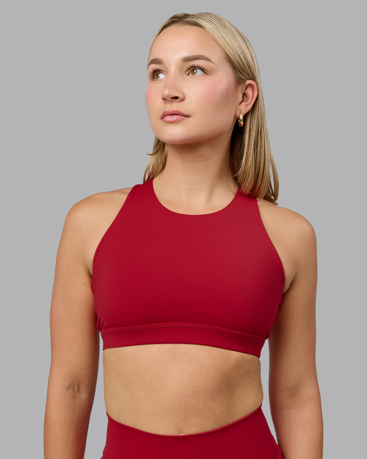 Woman wearing Pivot Sports Bra - Cherry Red
