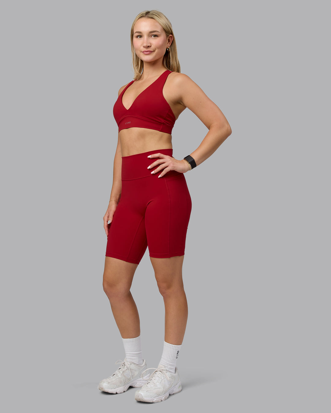 Woman wearing Poise Sports Bra - Cherry Red