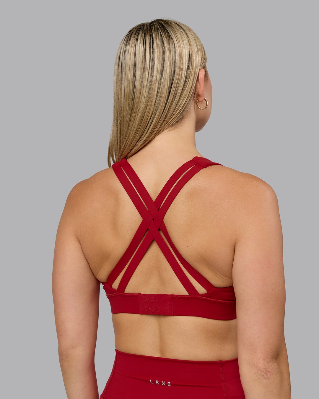 Woman wearing Poise Sports Bra - Cherry Red