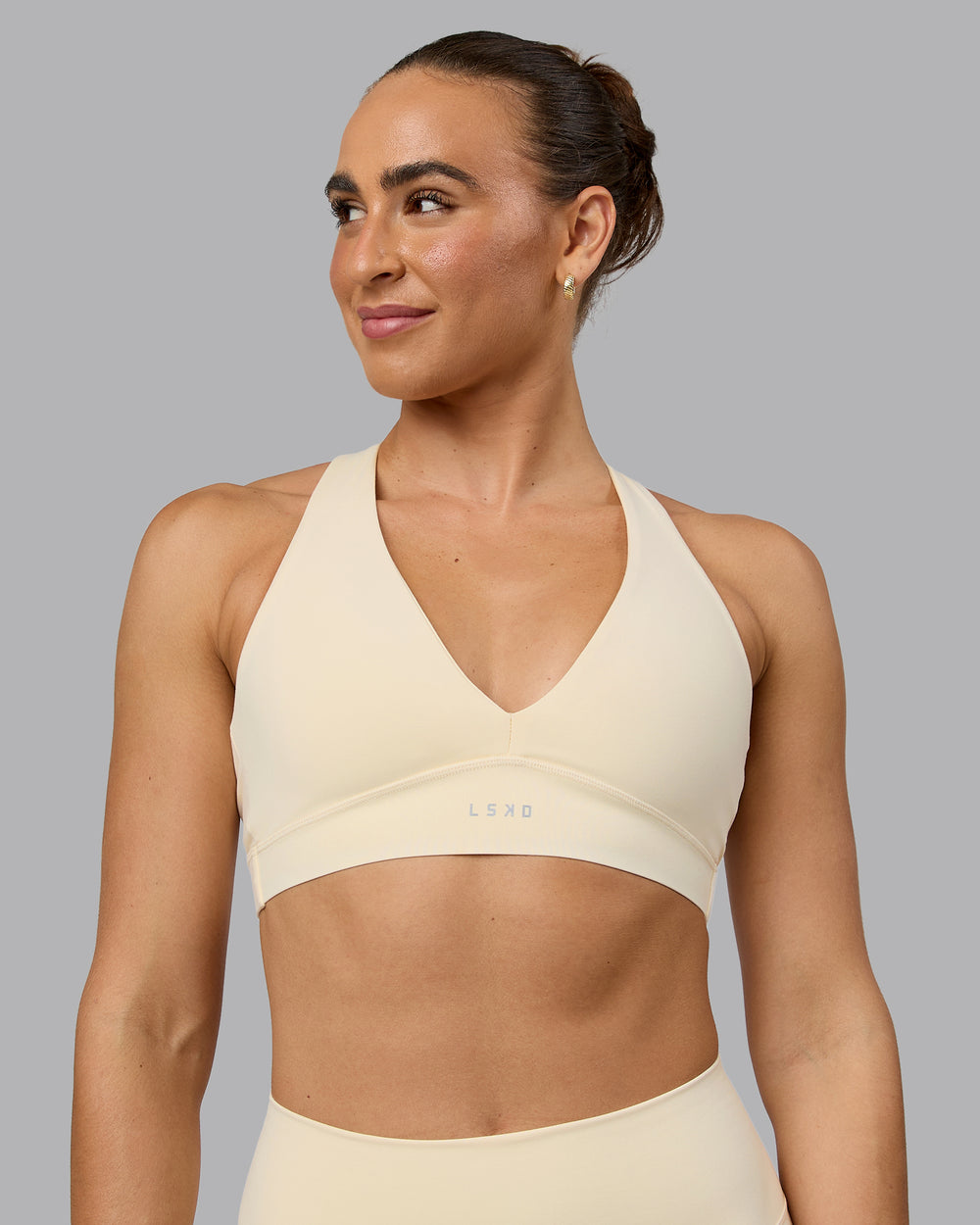 Woman wearing Poise Sports Bra - Ivory