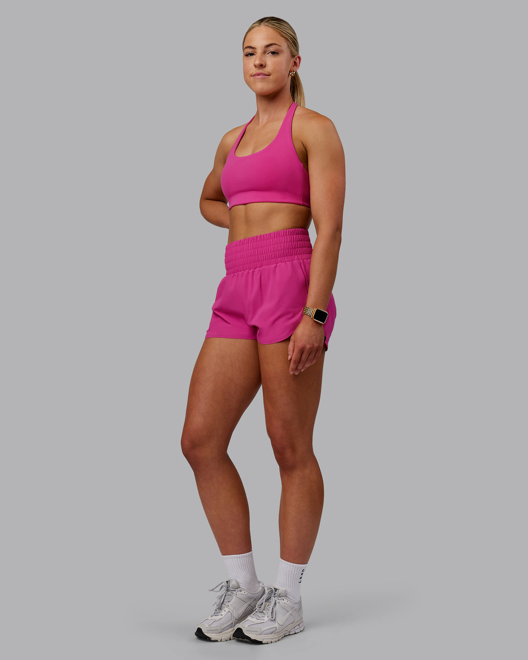 Woman wearing Power Train Shorts - Fuchsia Pink