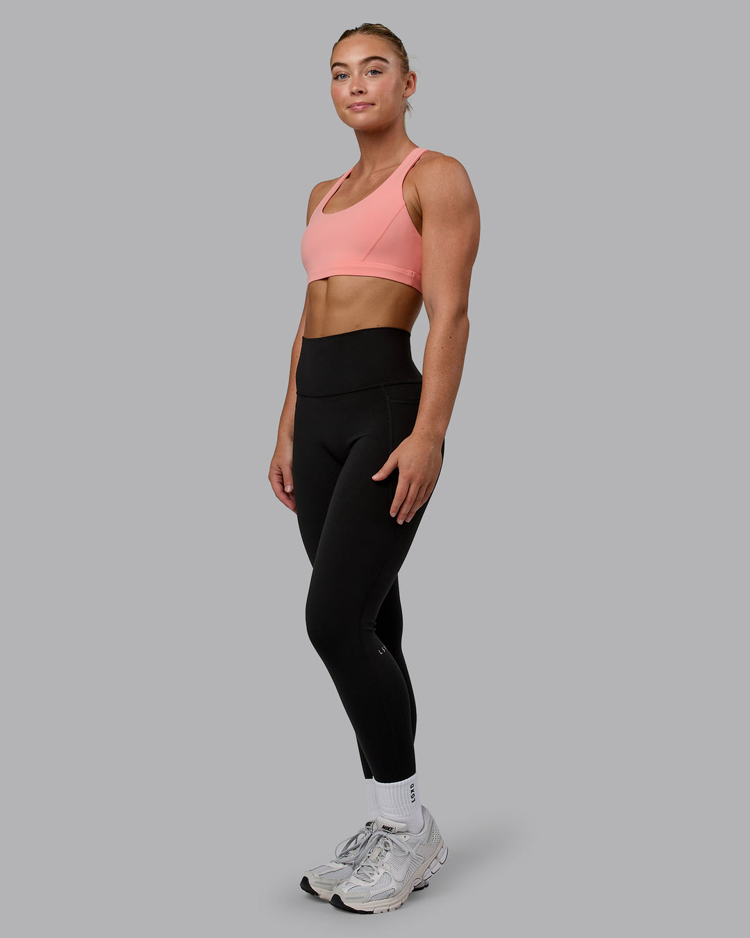 Woman wearing Precision Sports Bra - Murex Shell