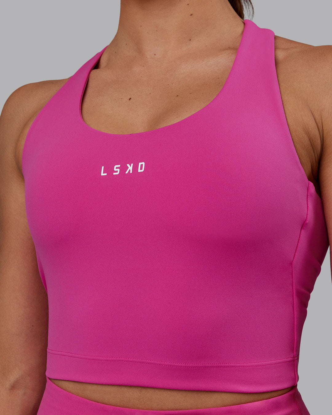 Woman wearing Pulse Active Tank - Fuchsia Pink