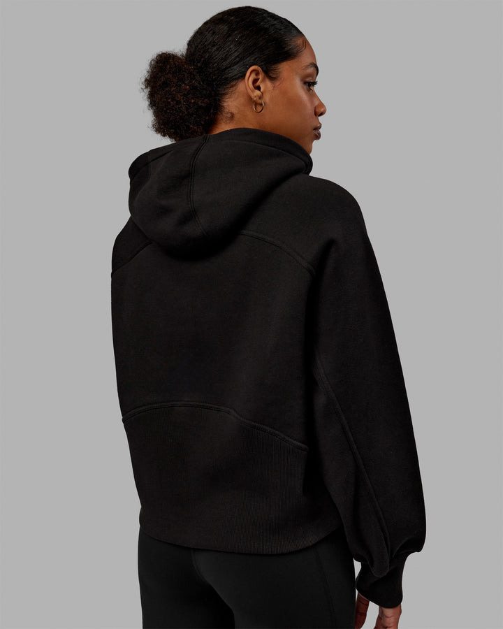 Woman wearing Pursue Hoodie - Black
