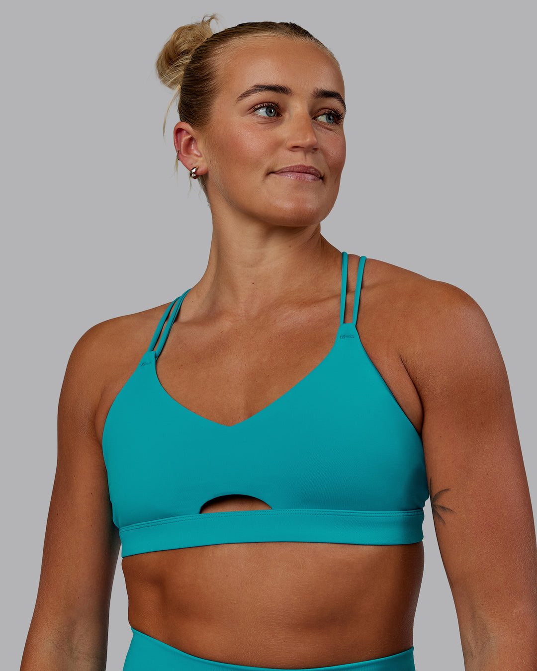 Woman wearing Pursue Sports Bra - Blue Bird