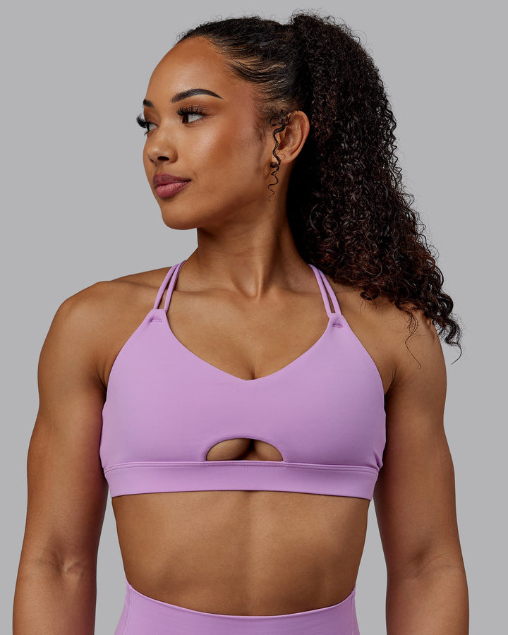 Woman wearing Pursue Sports Bra - Light Violet
