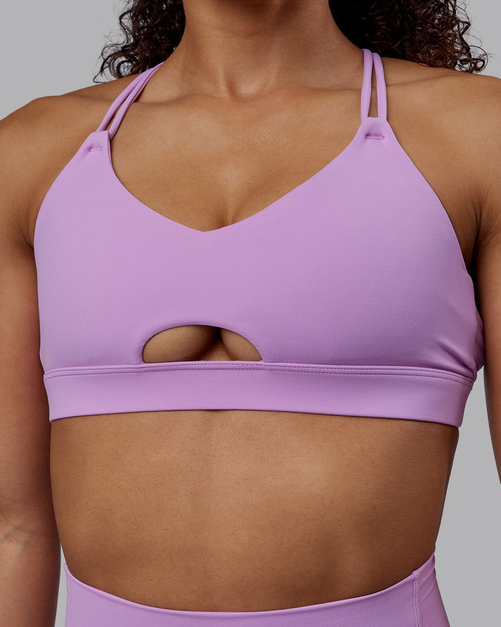 Woman wearing Pursue Sports Bra - Light Violet
