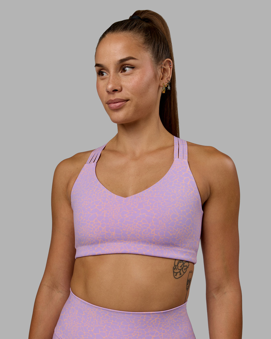 Woman wearing Push The Limit Sports Bra - Pale Lilac Vitality Print