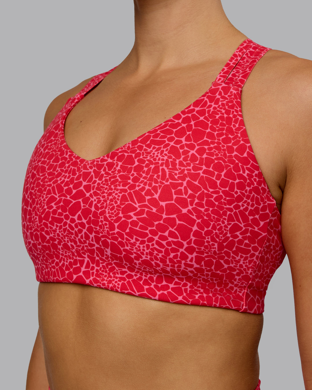 Woman wearing Push The Limit Sports Bra - Red Vitality Print