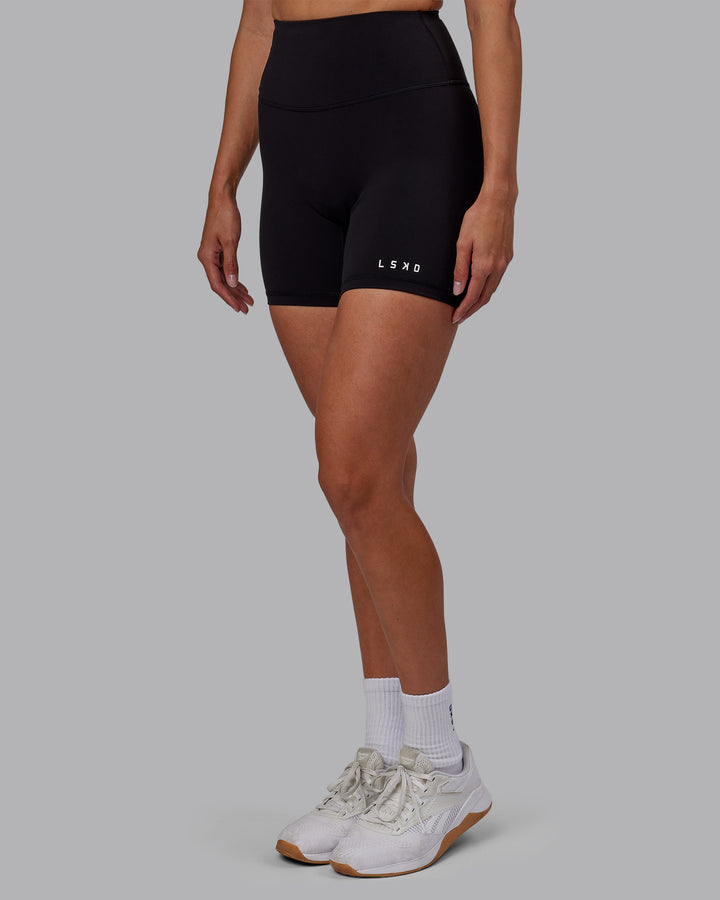 Woman wearing RXD High Waist Mid Short Tights - Black
