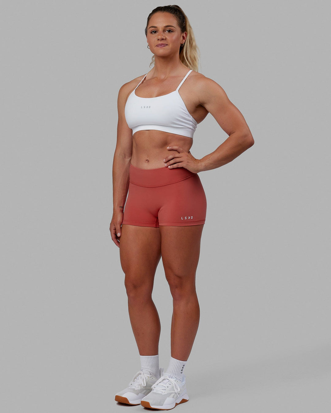 Woman wearing RXD Micro Short Tights - Mineral Red