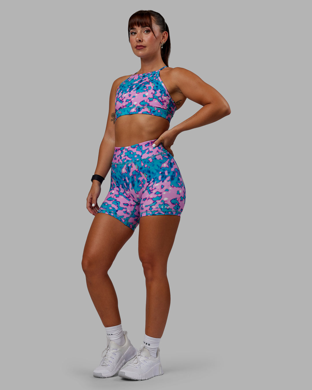 Woman wearing RXD Mid Short Tights - Neon Camo