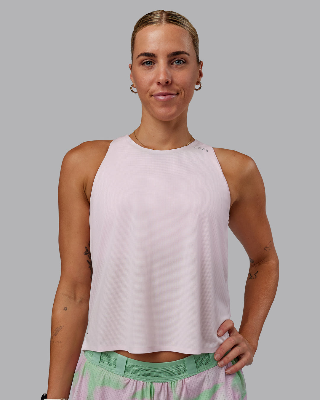 Woman wearing Race Day Performance Tank - Festival Bloom-White