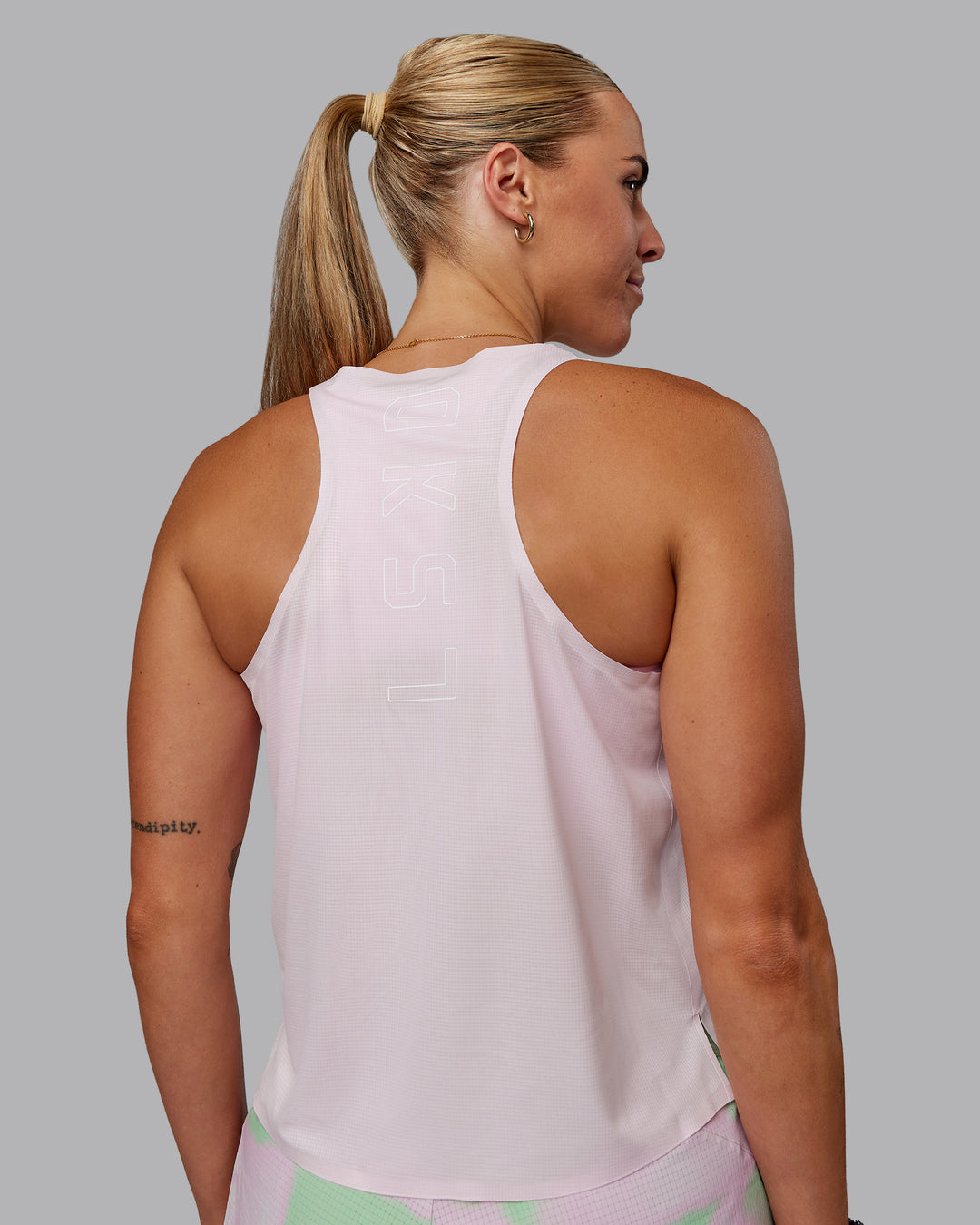 Woman wearing Race Day Performance Tank - Festival Bloom-White