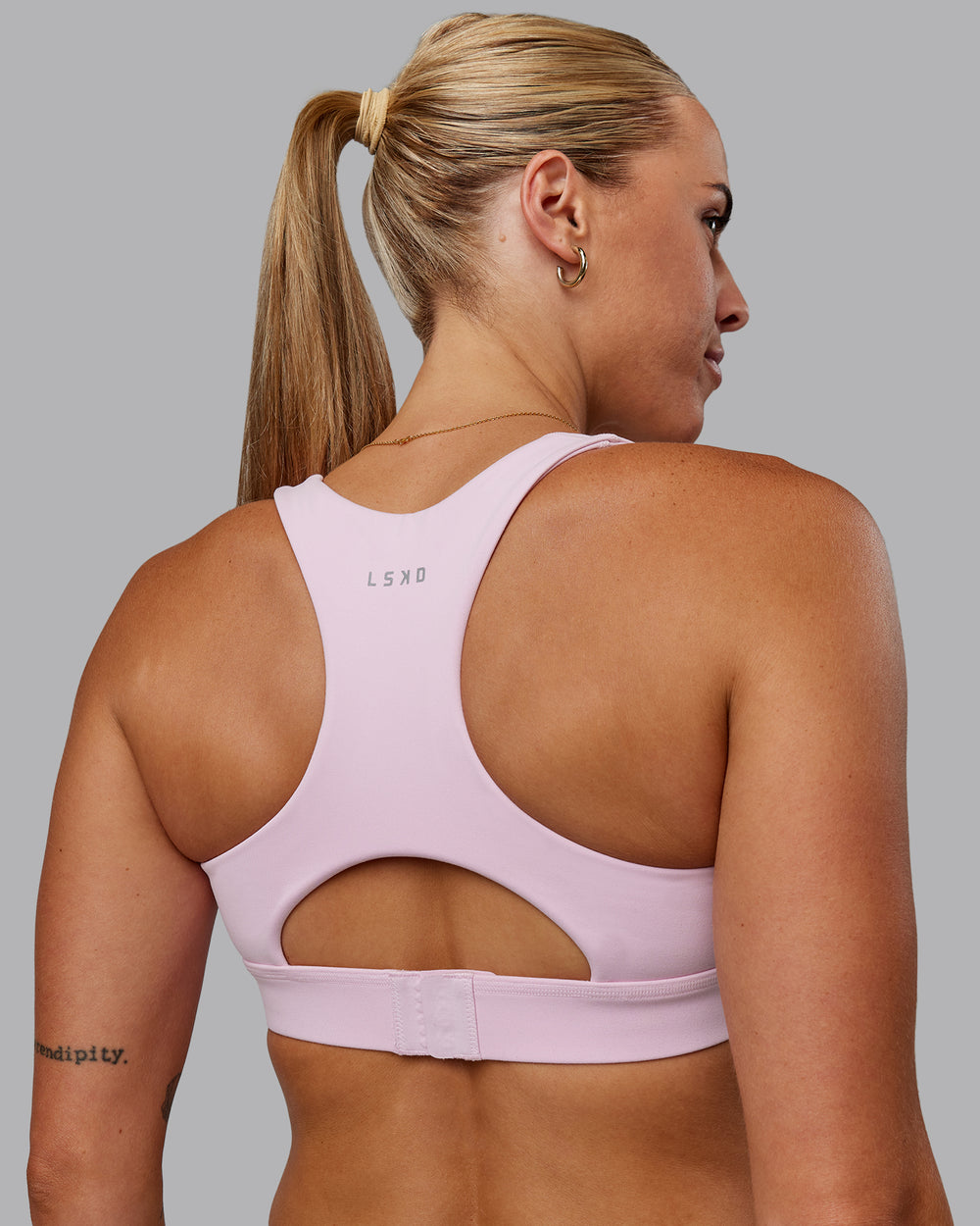 Woman wearing Race Day Sports Bra - Marshmallow