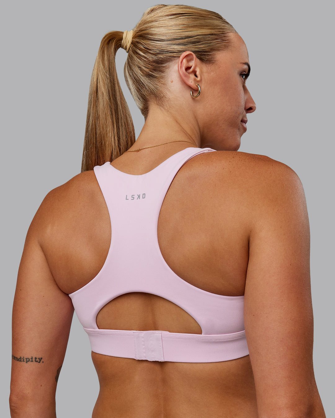 Woman wearing Race Day Sports Bra - Marshmallow