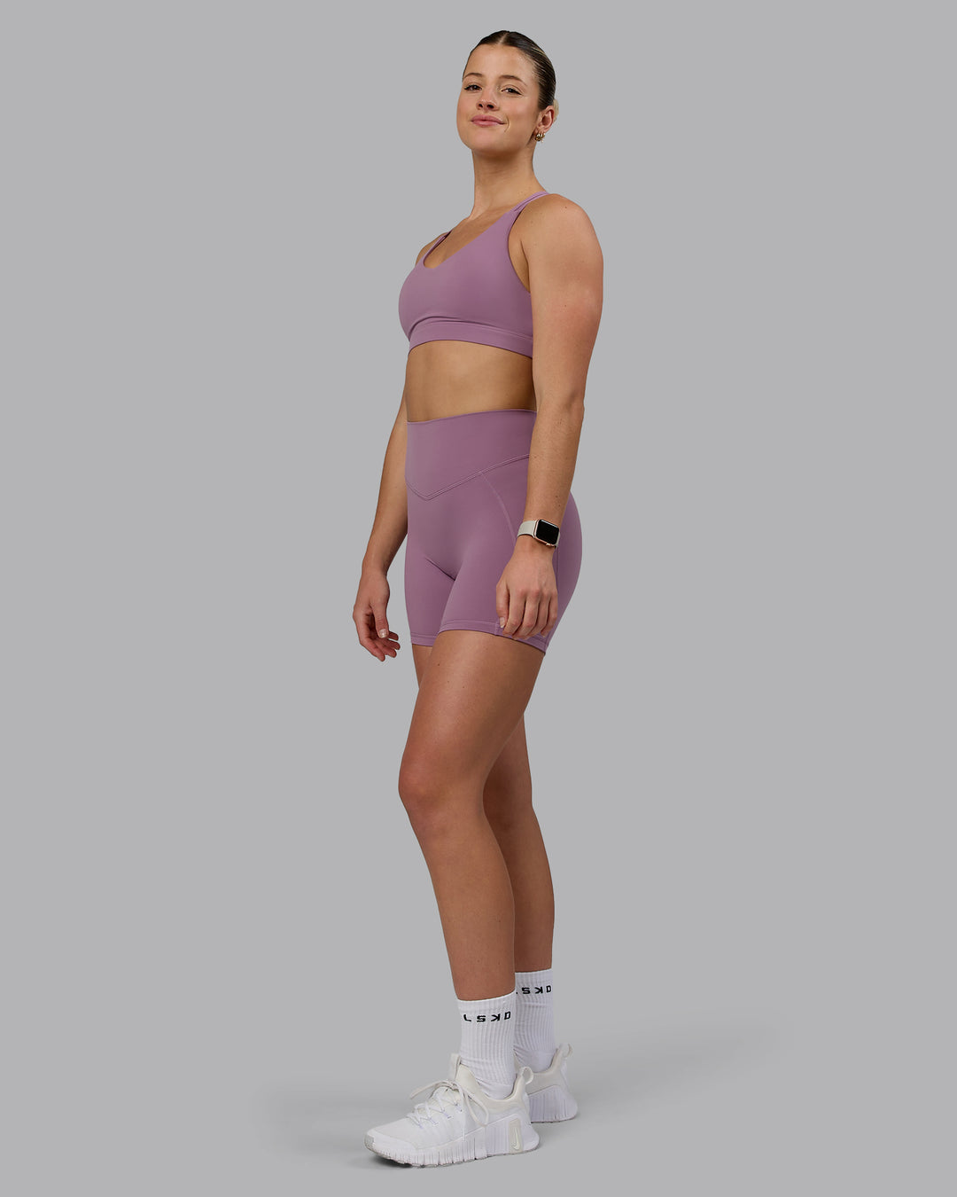 Woman wearing Radiance Sports Bra - Grape