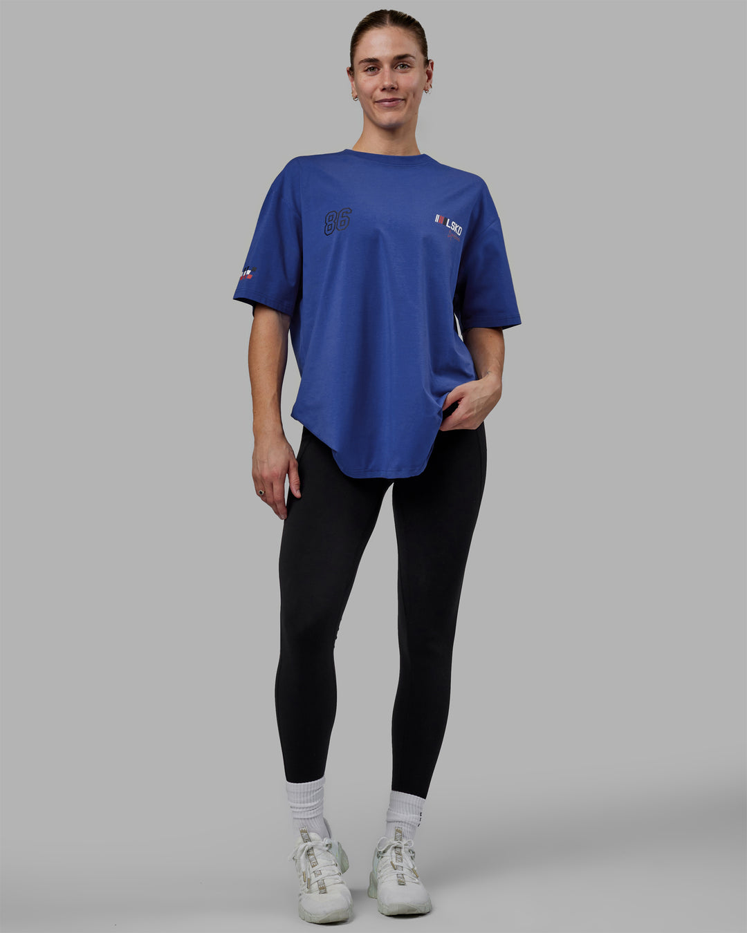 Woman wearing Unisex Redline FLXCotton Tee Oversize - Power Cobalt-White