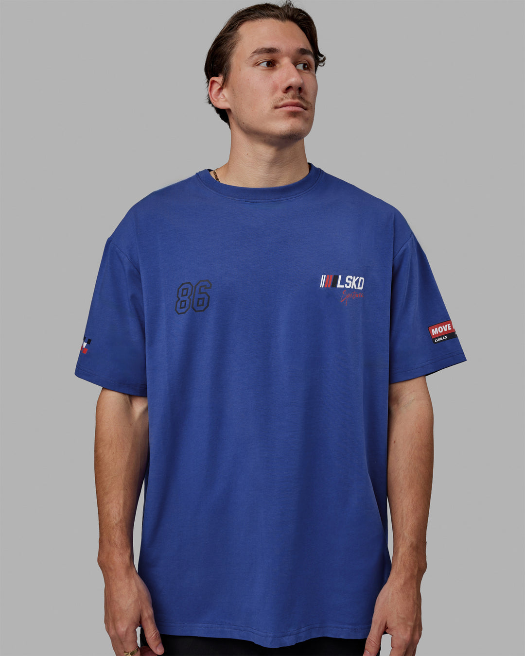 Man wearing Unisex Redline FLXCotton Tee Oversize - Power Cobalt-White