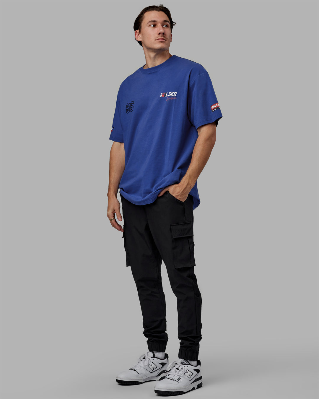 Man wearing Unisex Redline FLXCotton Tee Oversize - Power Cobalt-White