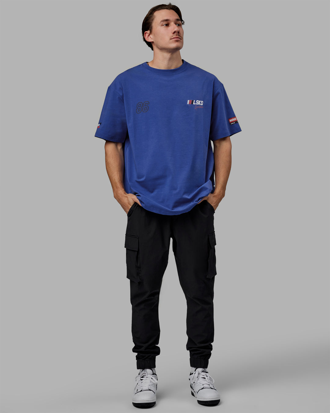 Man wearing Unisex Redline FLXCotton Tee Oversize - Power Cobalt-White