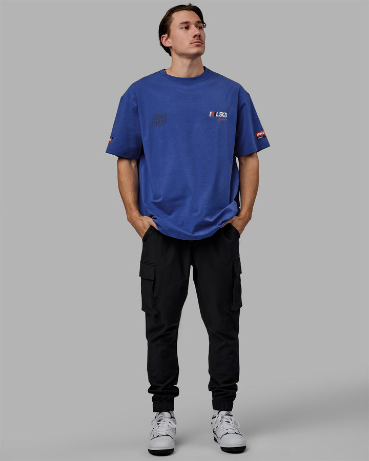 Man wearing Unisex Redline FLXCotton Tee Oversize - Power Cobalt-White
