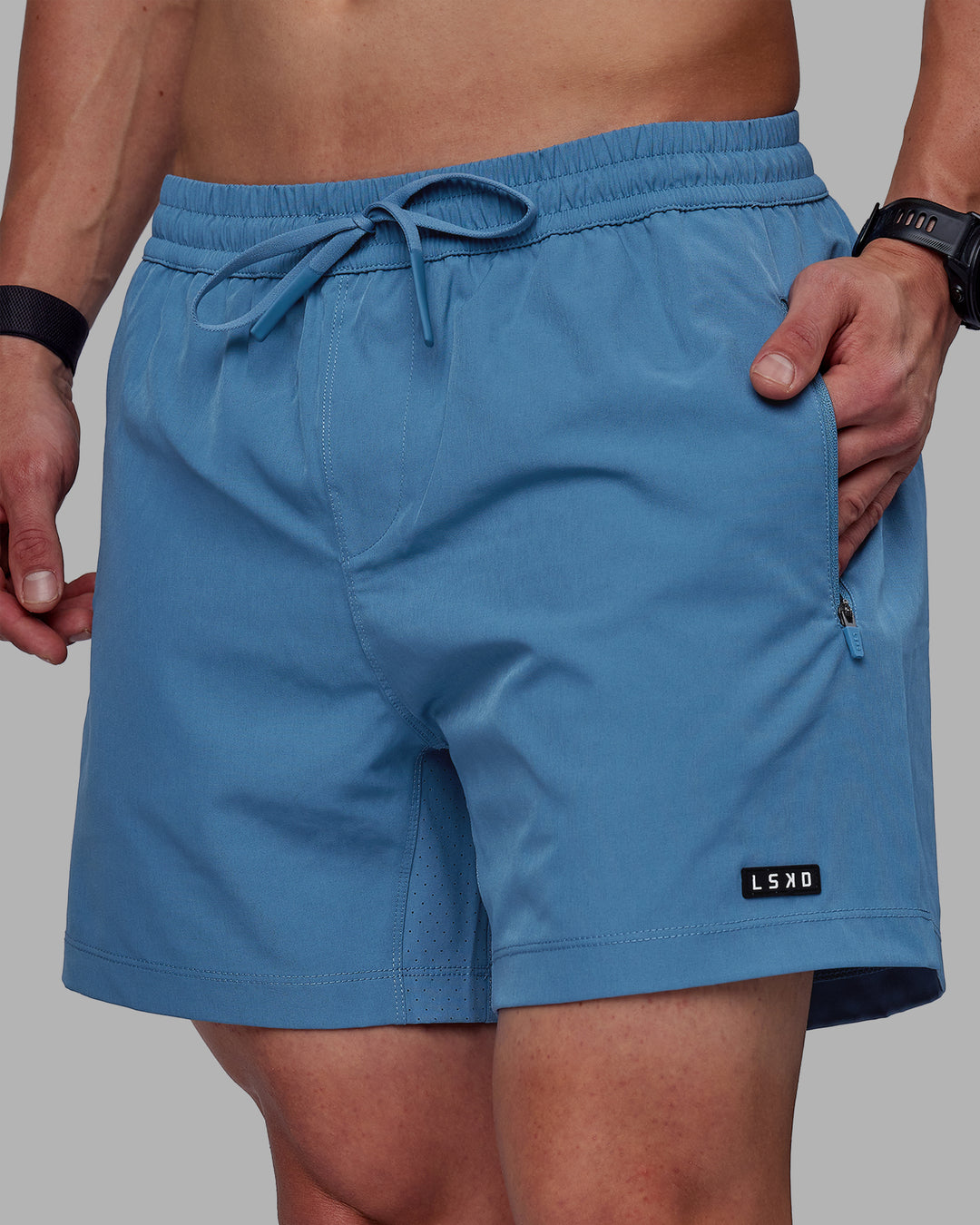 Man wearing Rep 5&quot; Lined Performance Shorts - Elemental Blue