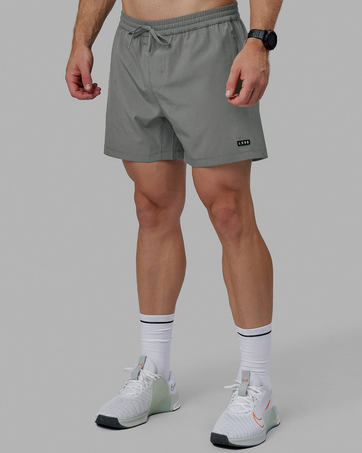 Man wearing Rep 5&quot; Lined Performance Shorts - Graphite
